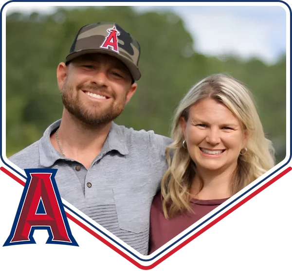 Two members of the family behind Advocate Plumbing, smiling outdoors